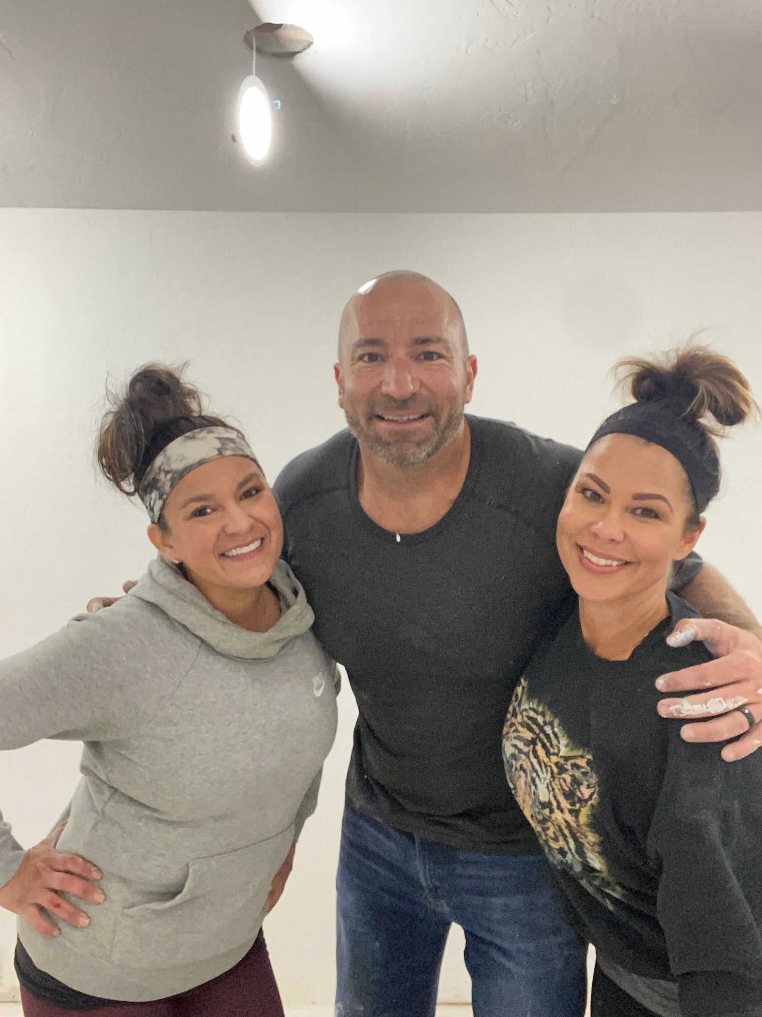 Matt, Lisa, and Marisa Painting A Home